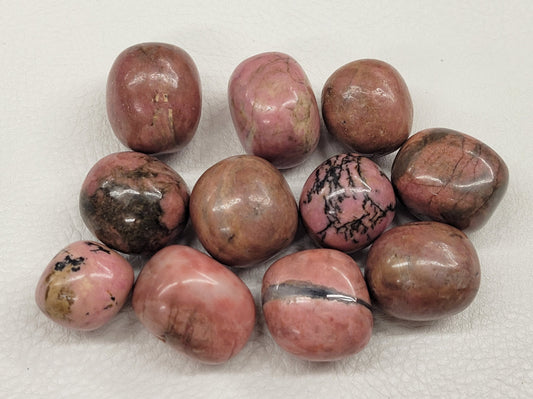 Rhodonite tumbles