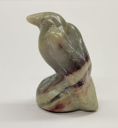A small carving of a raven made from banded Jasper, approximately 1.5 inches tall.
