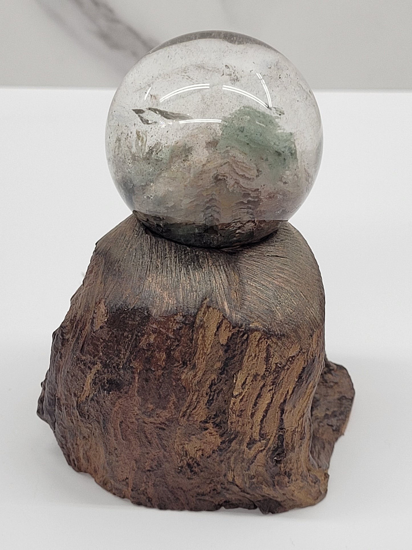 Garden Quartz statement sphere on driftwood stand