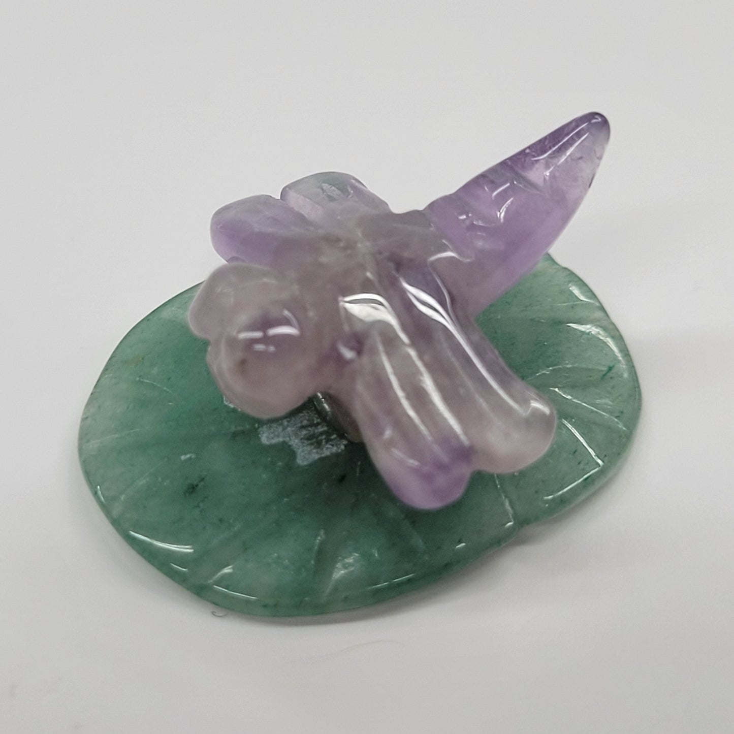 Dragonfly on lily pad carvings