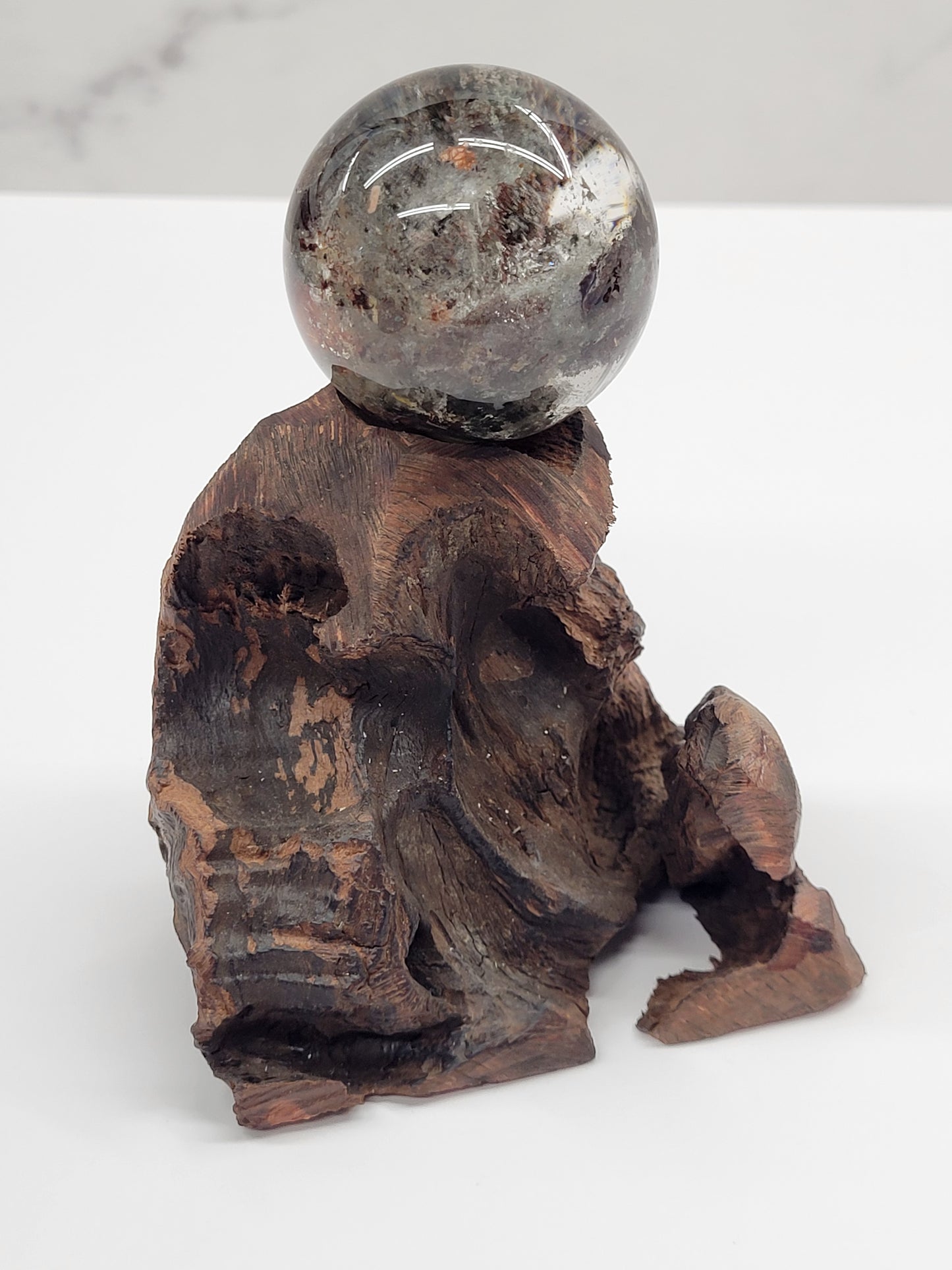 Garden Quartz statement sphere on driftwood stand