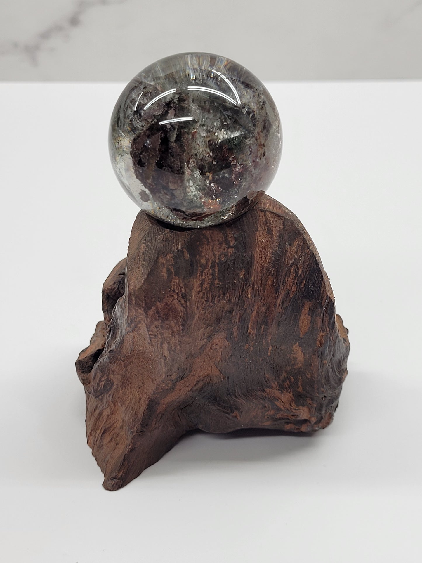 Garden Quartz statement sphere on driftwood stand