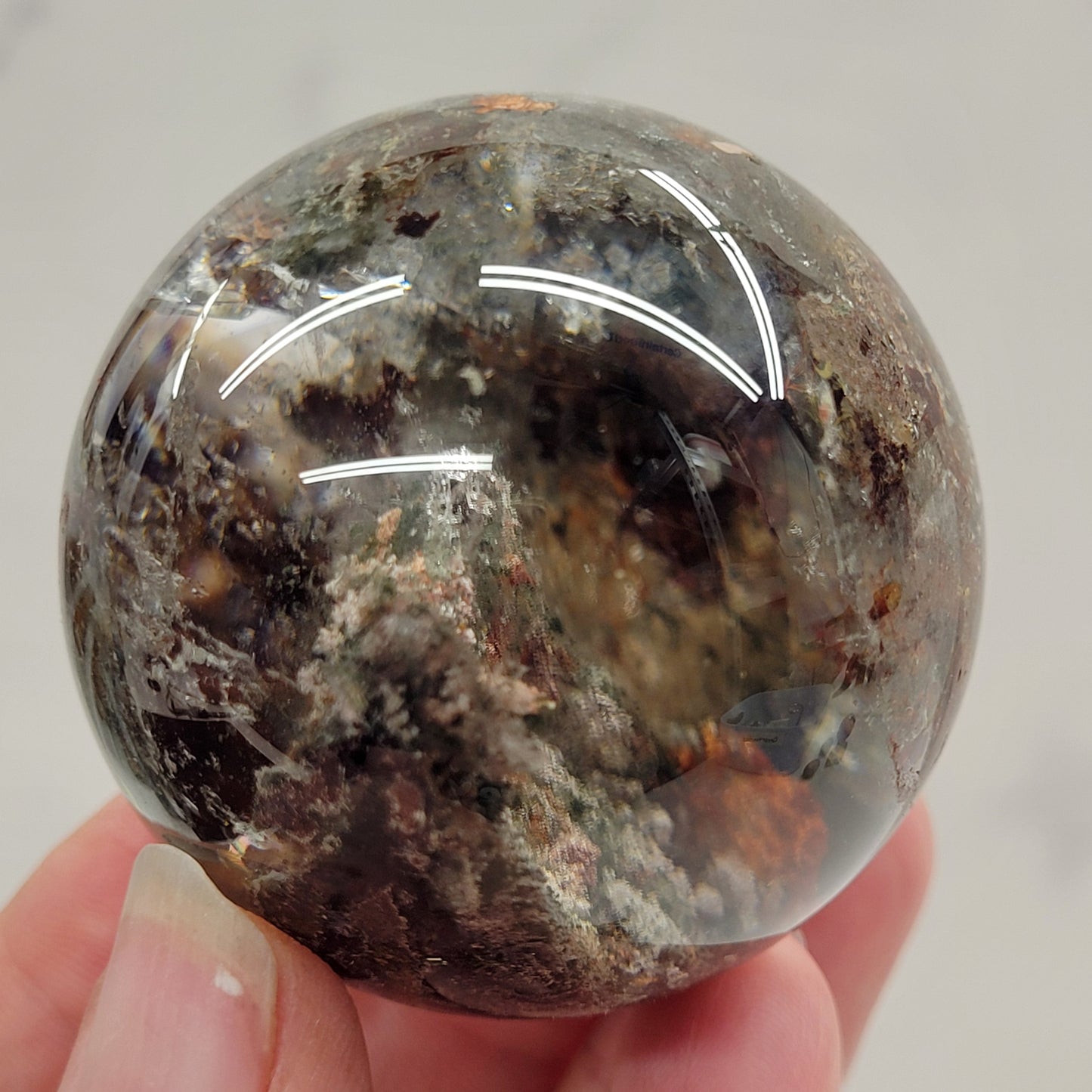 Garden Quartz statement sphere on driftwood stand