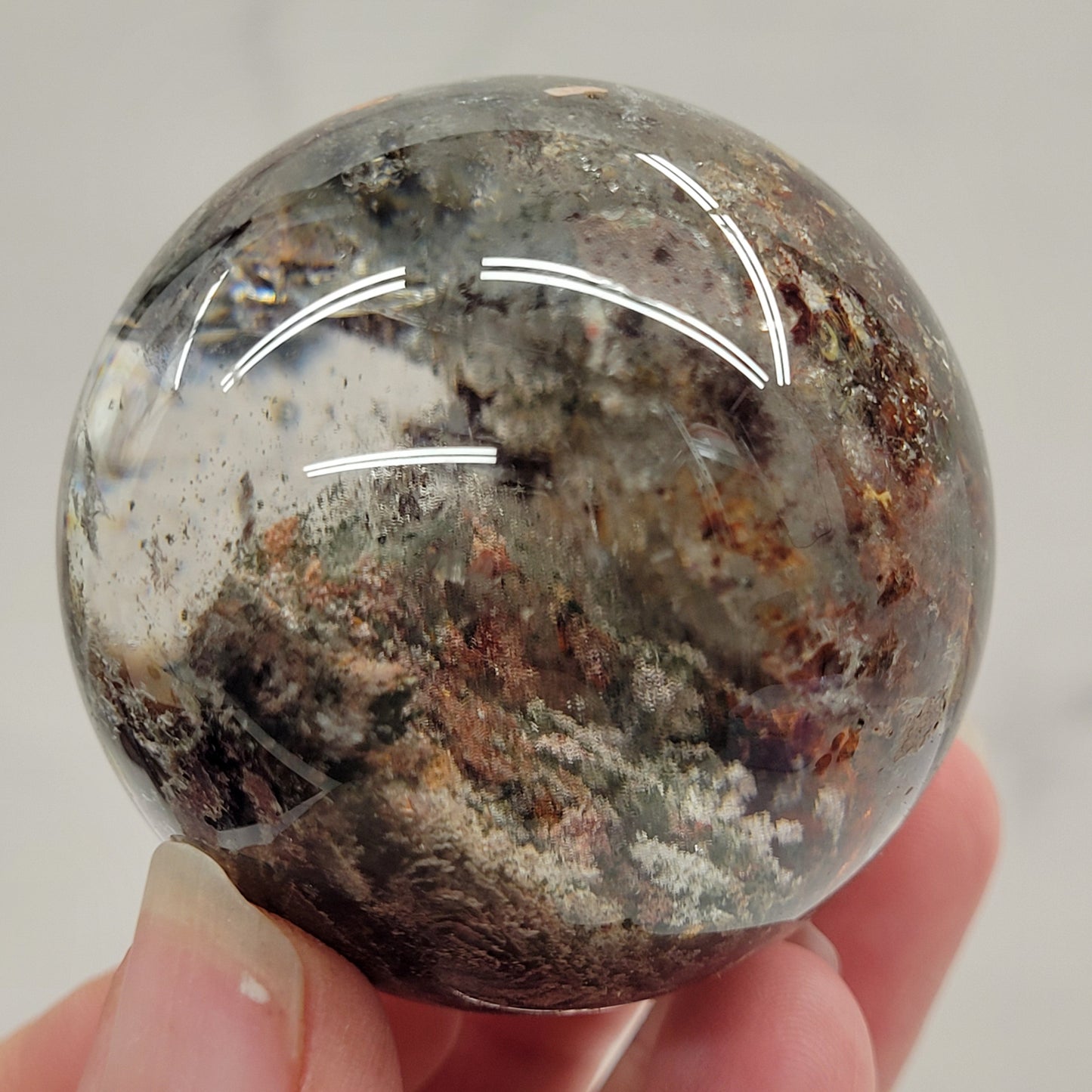 Garden Quartz statement sphere on driftwood stand