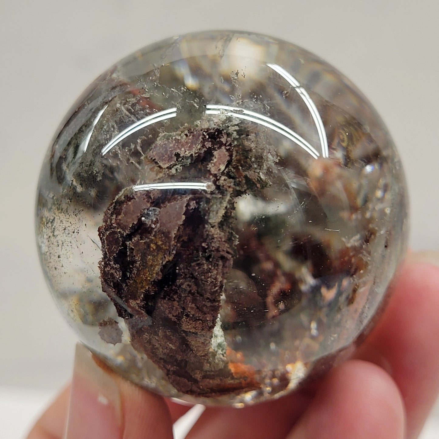 Garden Quartz statement sphere on driftwood stand