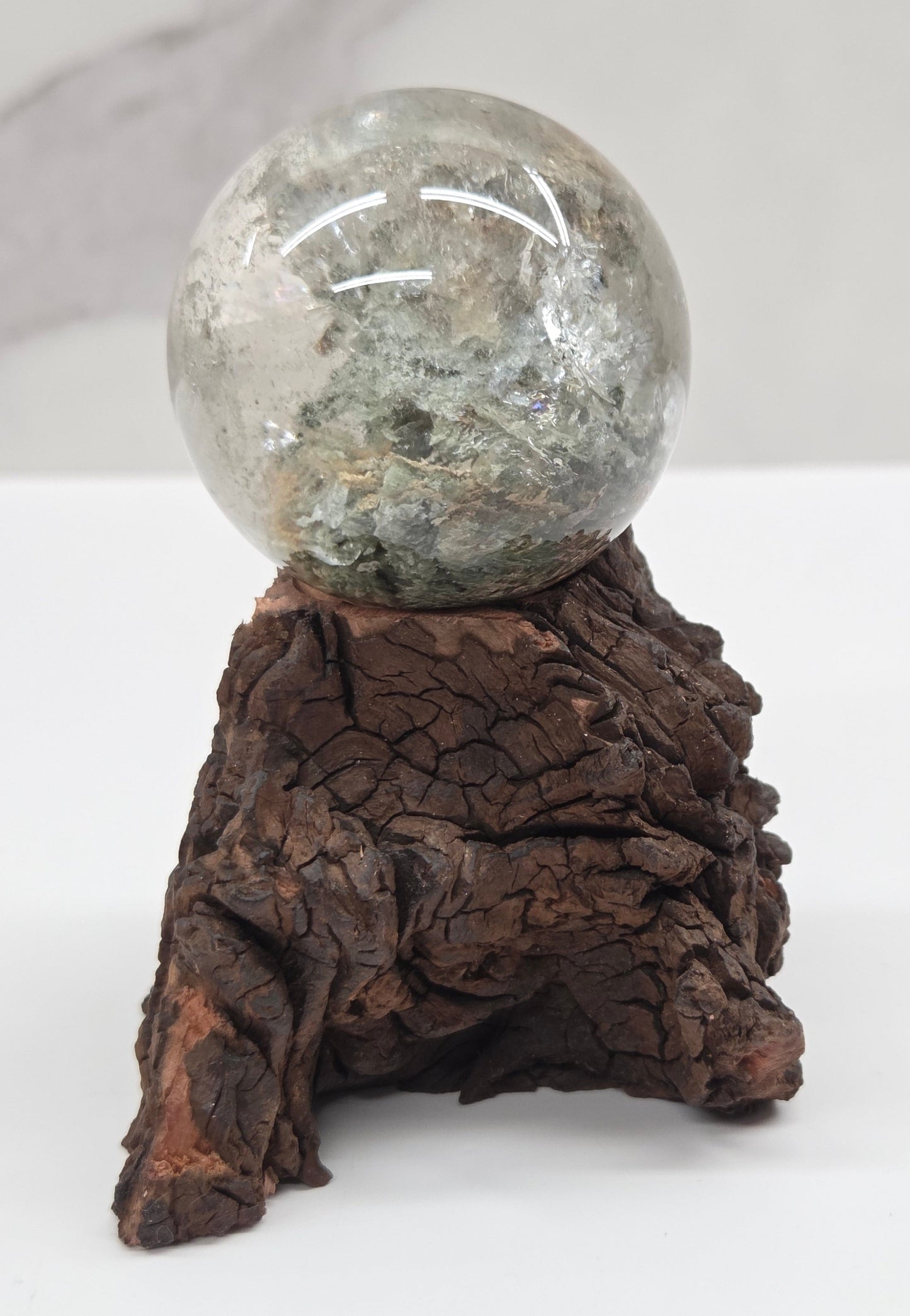 Garden Quartz statement sphere on driftwood stand