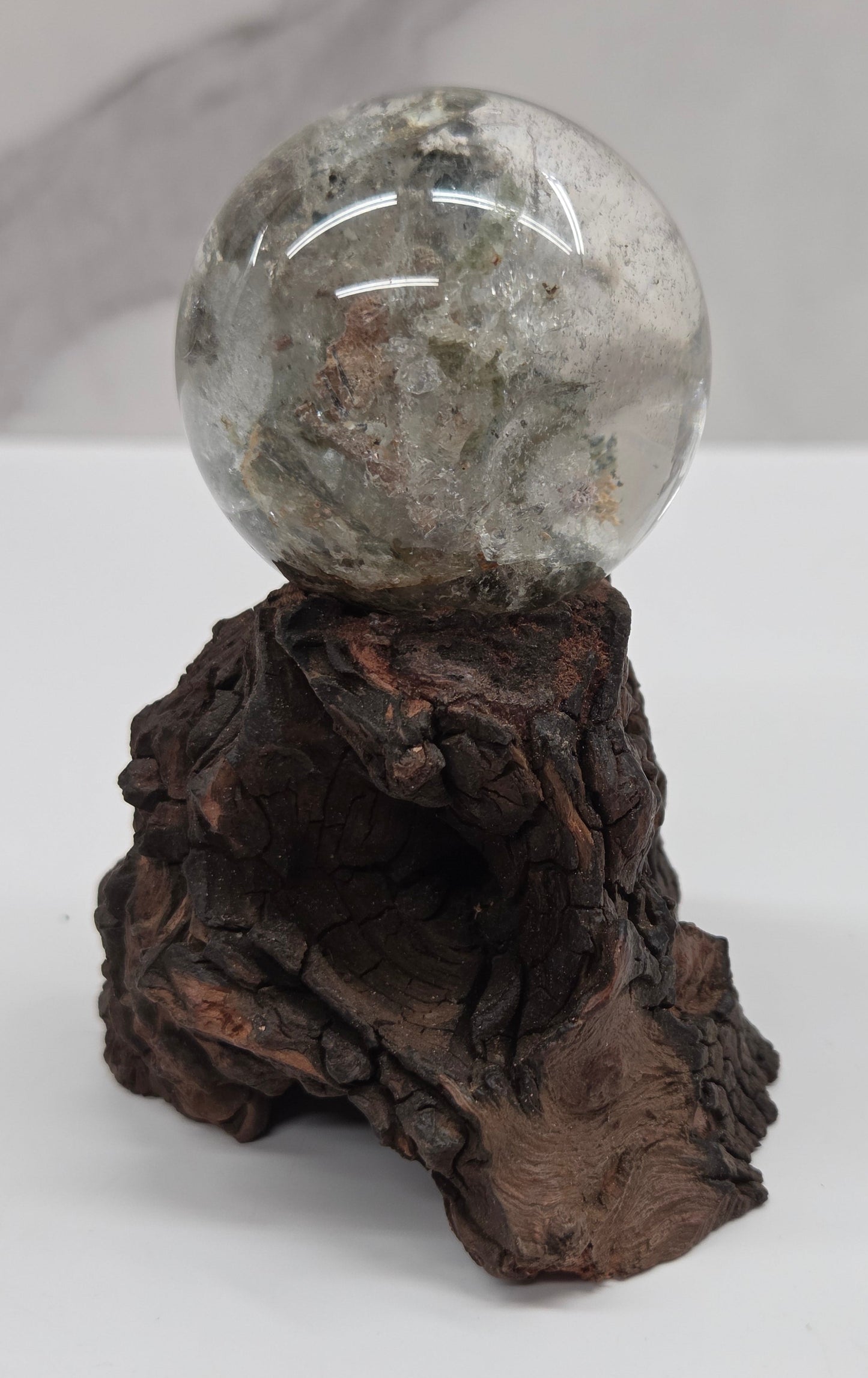 Garden Quartz statement sphere on driftwood stand