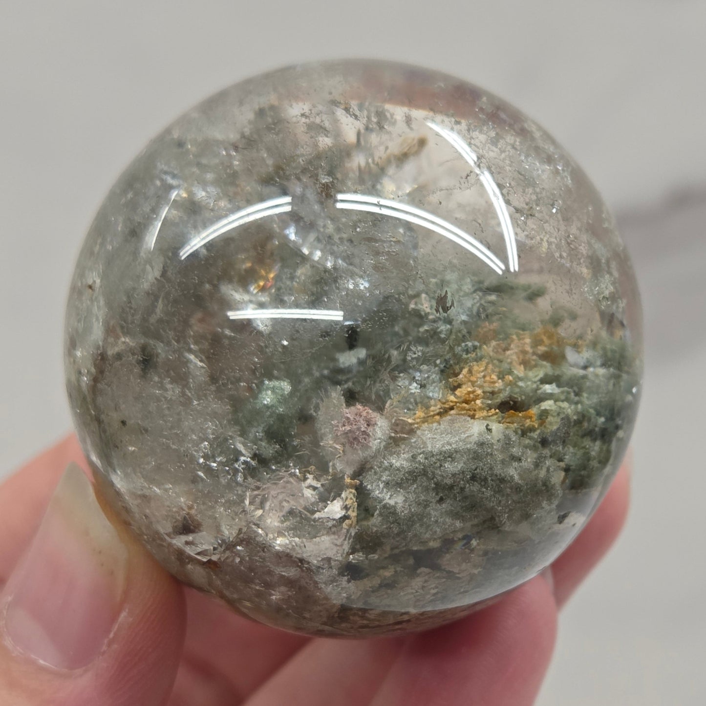 Garden Quartz statement sphere on driftwood stand