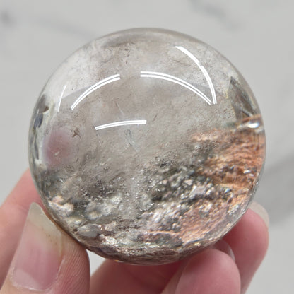 Garden Quartz statement sphere on driftwood stand