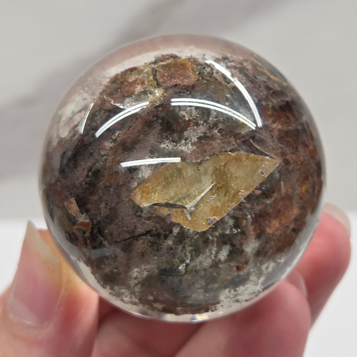 Garden Quartz statement sphere on driftwood stand