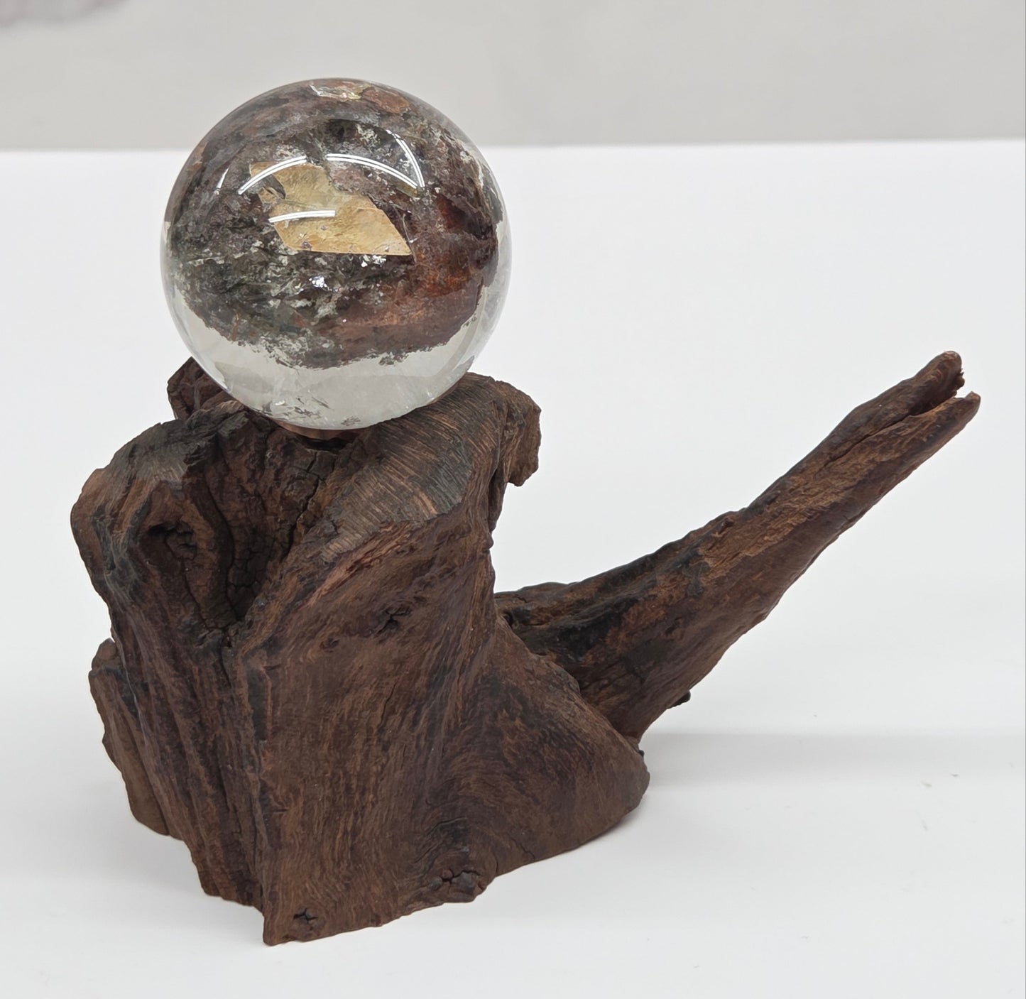Garden Quartz statement sphere on driftwood stand
