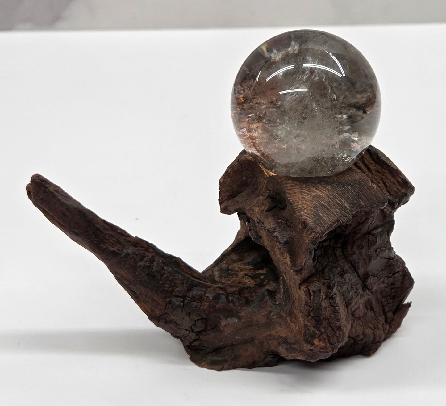 Garden Quartz statement sphere on driftwood stand