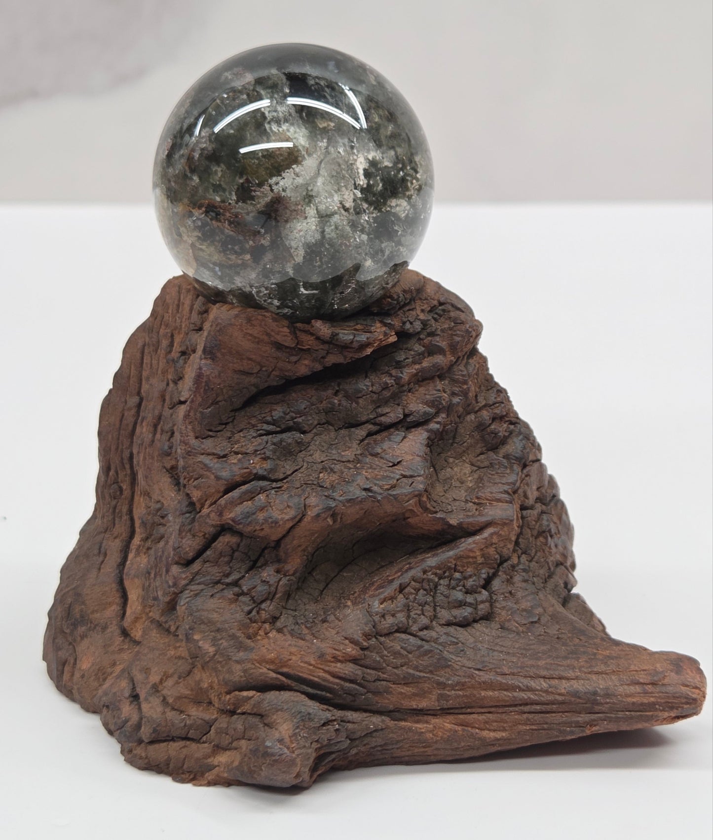 Garden Quartz statement sphere on driftwood stand
