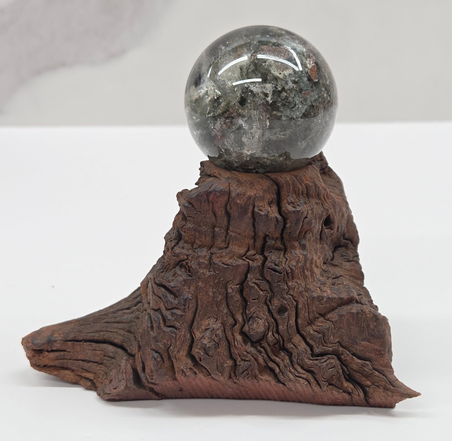 Garden Quartz statement sphere on driftwood stand