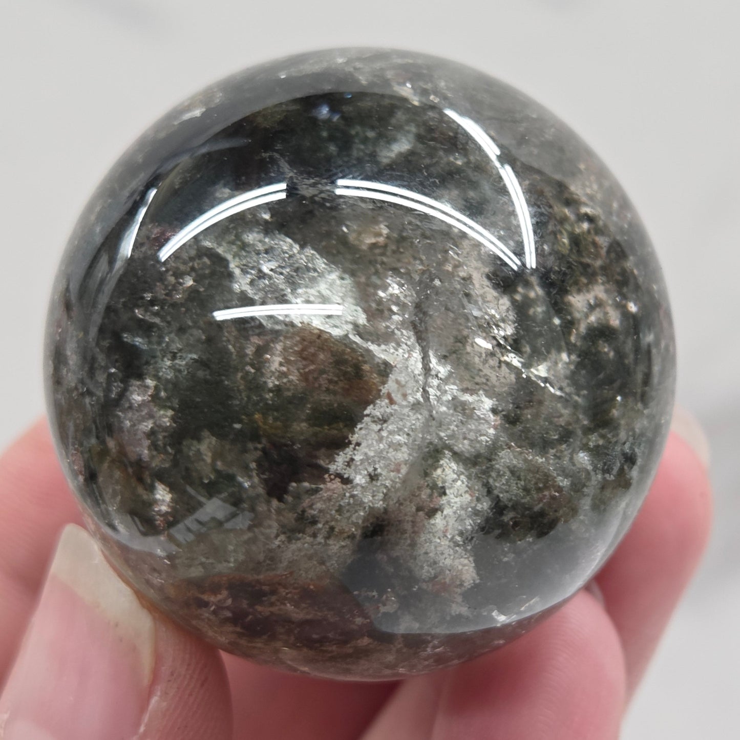 Garden Quartz statement sphere on driftwood stand