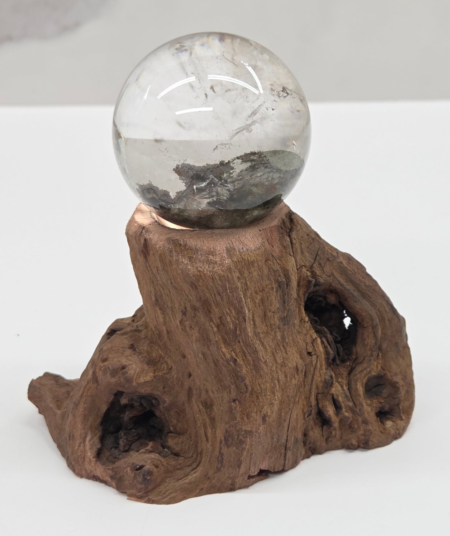 Garden Quartz statement sphere on driftwood stand
