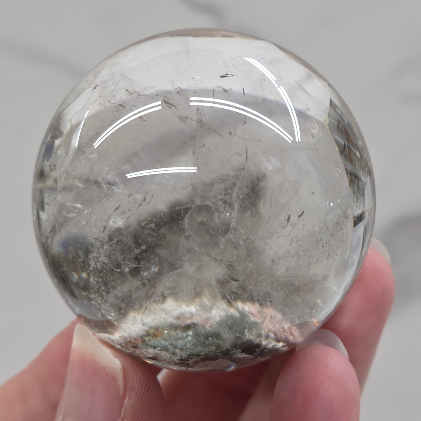 Garden Quartz statement sphere on driftwood stand