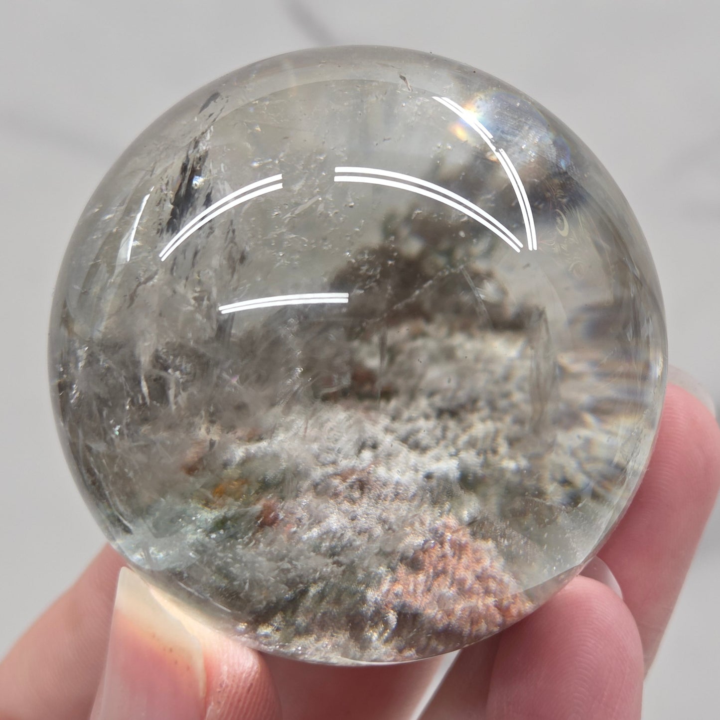 Garden Quartz statement sphere on driftwood stand