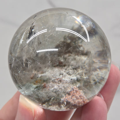 Garden Quartz statement sphere on driftwood stand