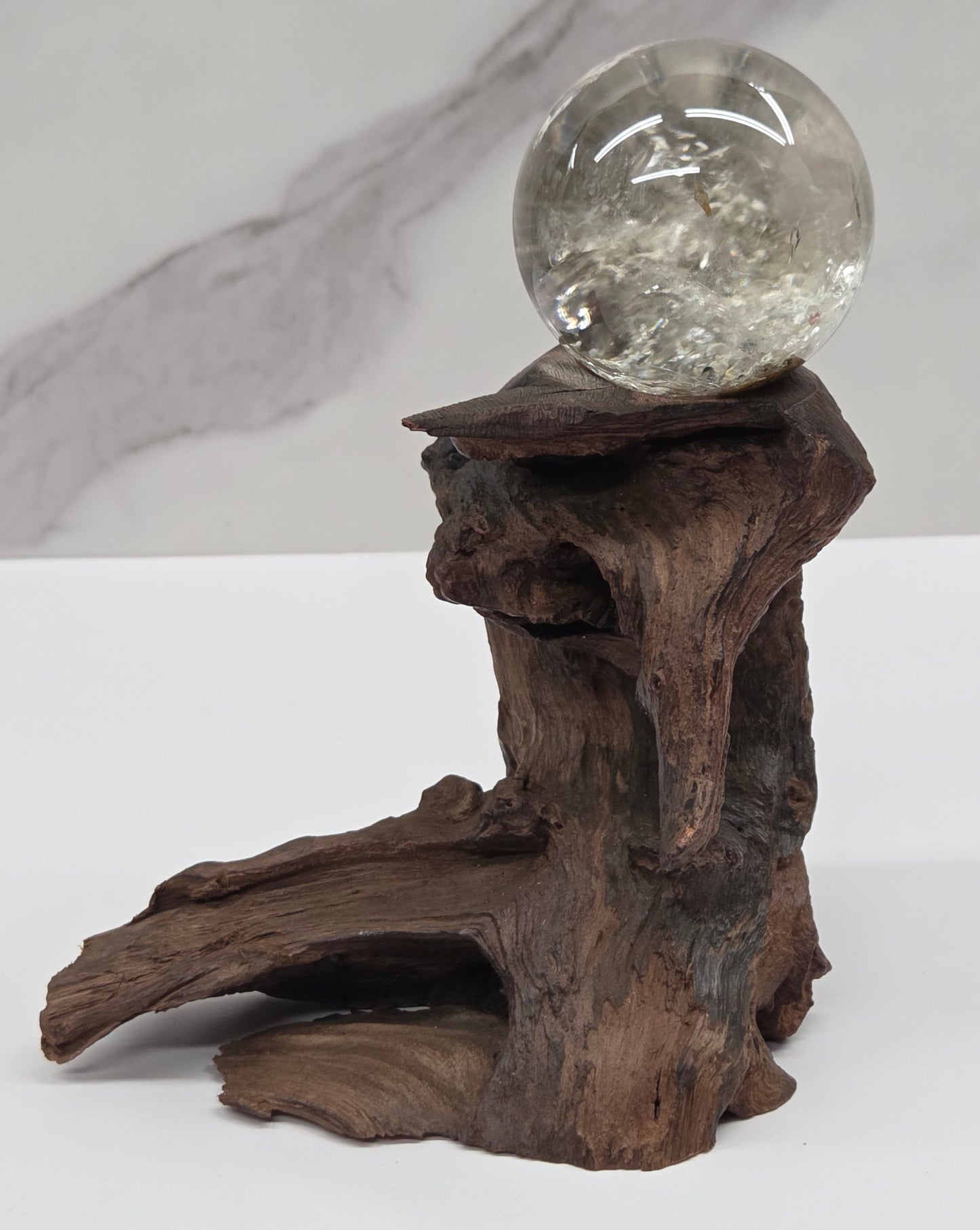 Garden Quartz statement sphere on driftwood stand