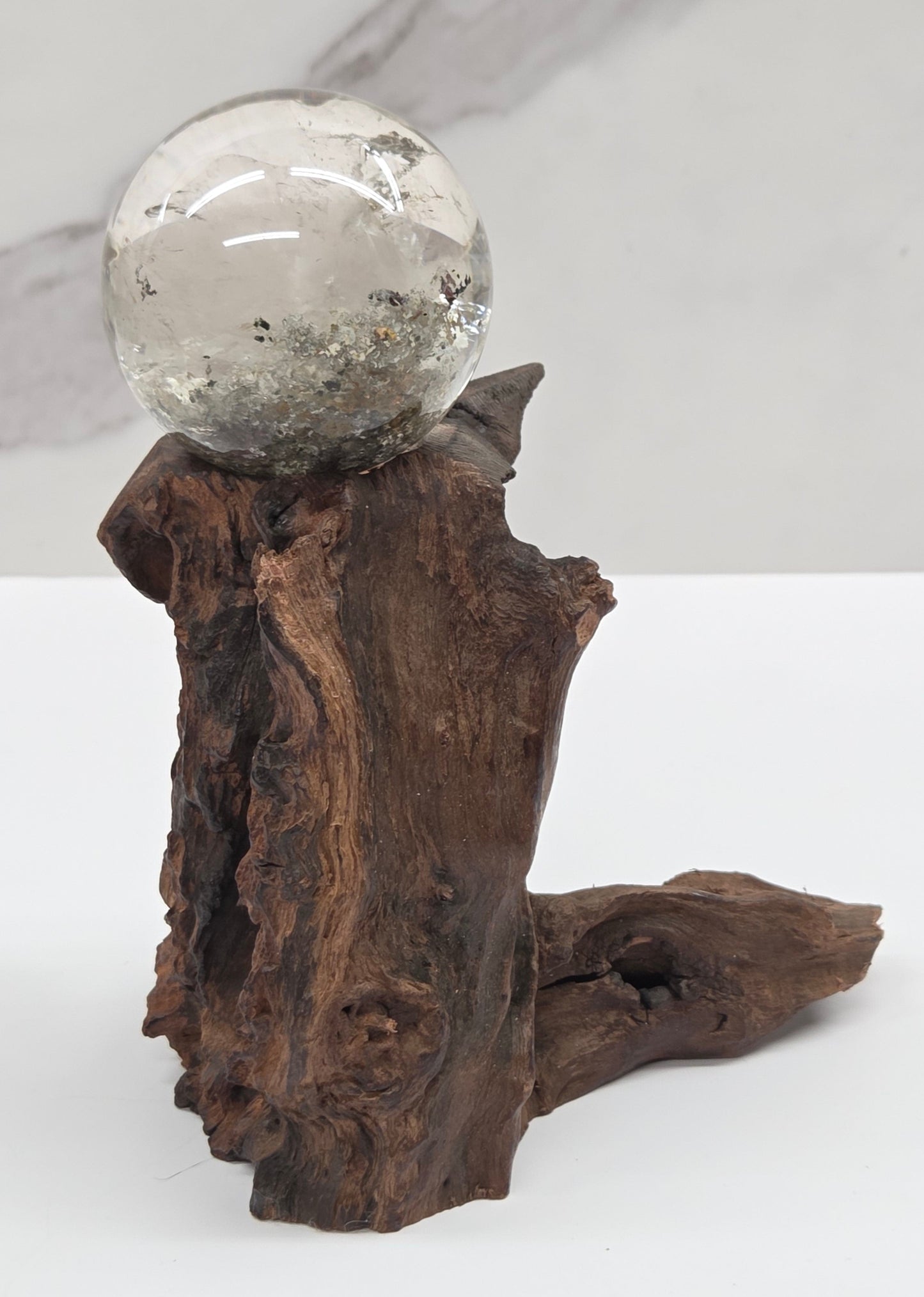 Garden Quartz statement sphere on driftwood stand