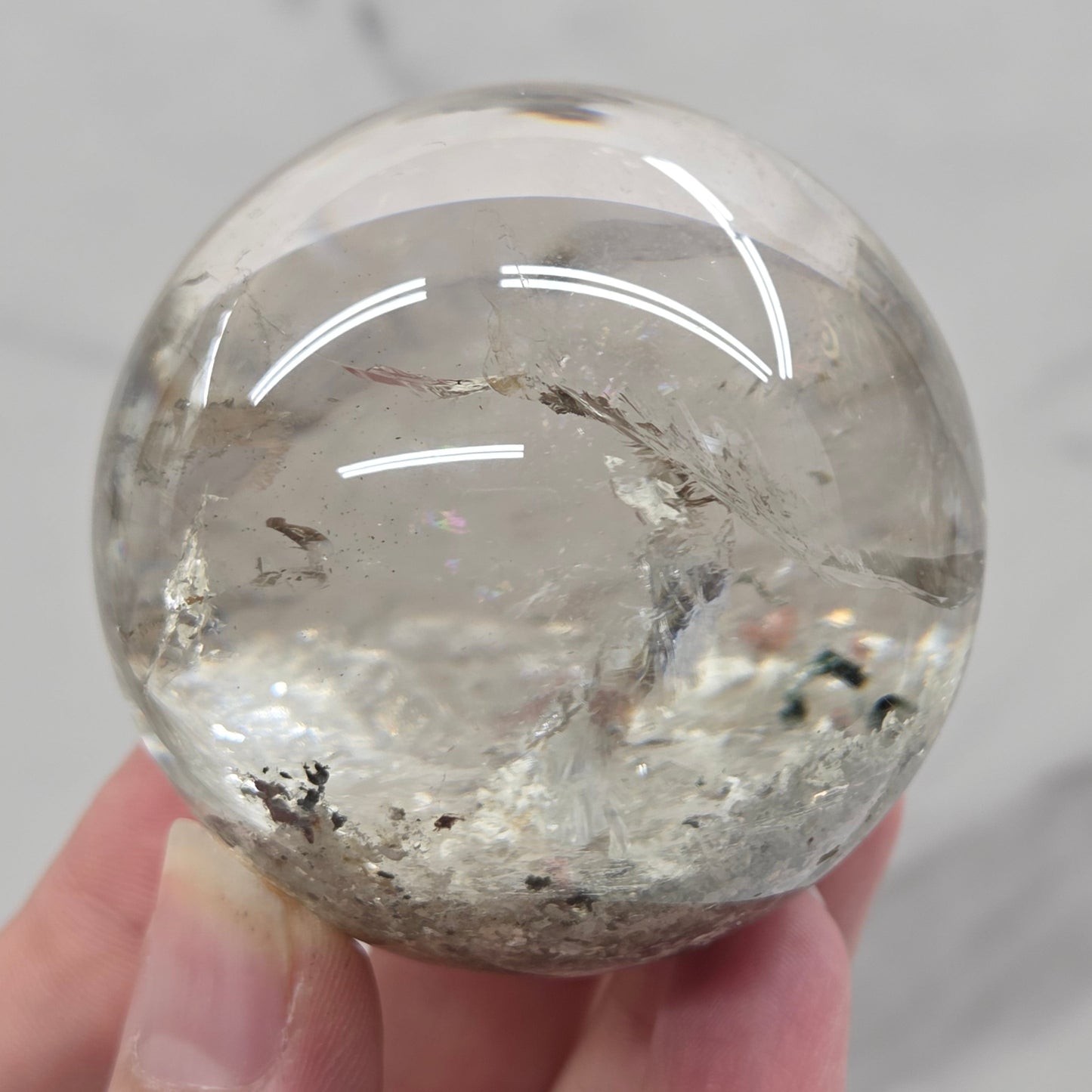 Garden Quartz statement sphere on driftwood stand
