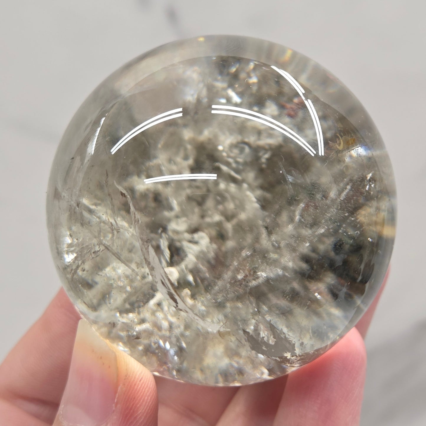 Garden Quartz statement sphere on driftwood stand