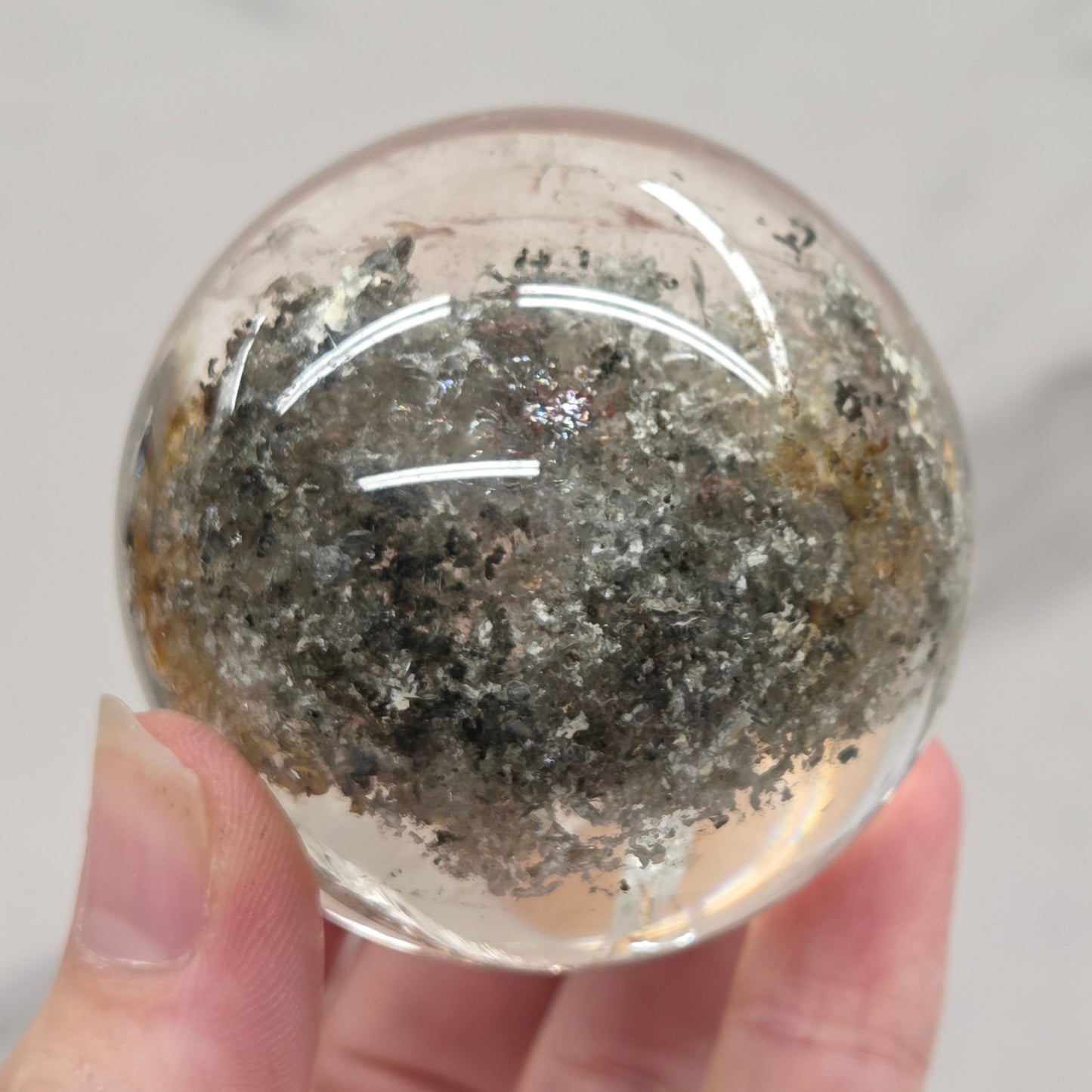 Garden Quartz statement sphere on driftwood stand