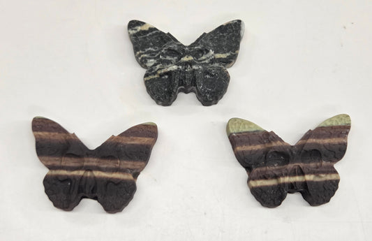 Skull moth carving