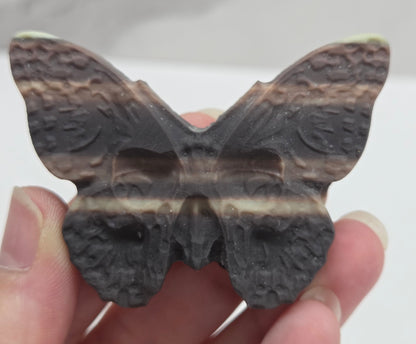 Skull moth carving