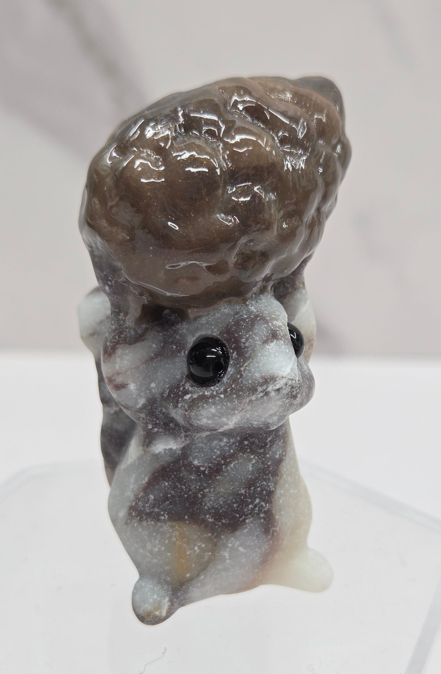 Squirrel holding nut carving