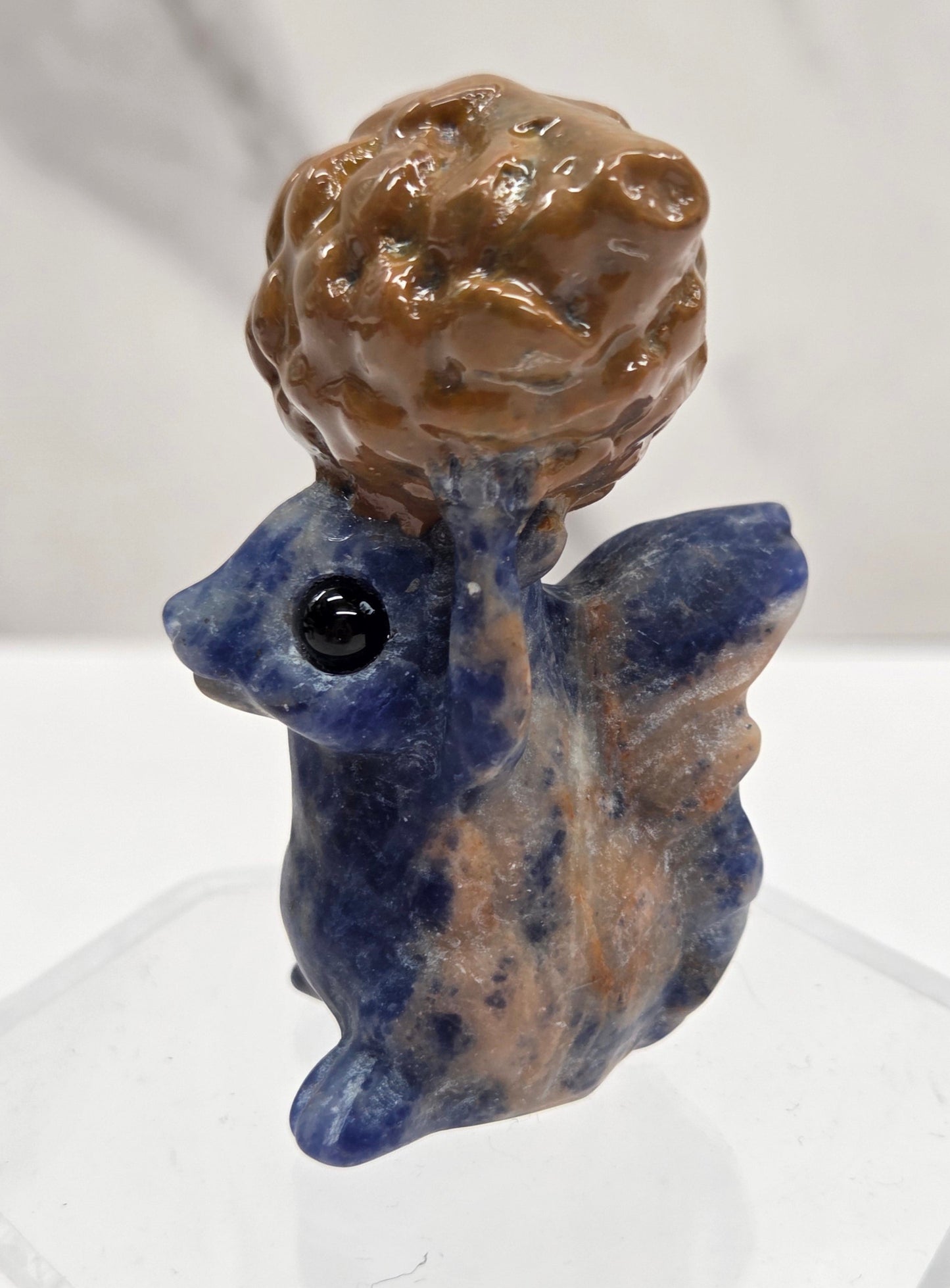 Squirrel holding nut carving