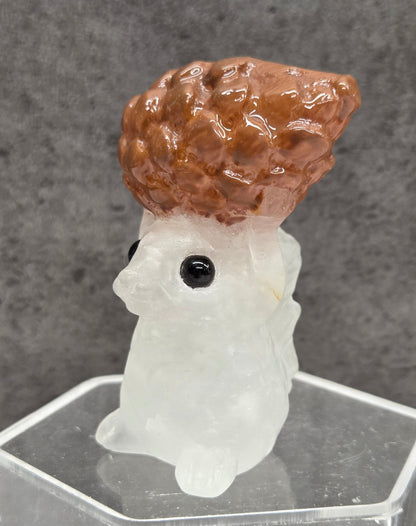 Squirrel holding nut carving