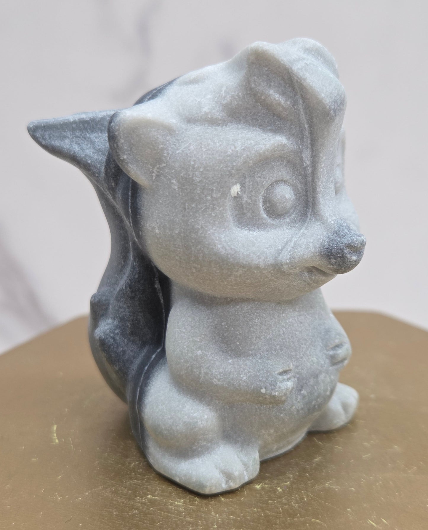 "Flower" skunk carving
