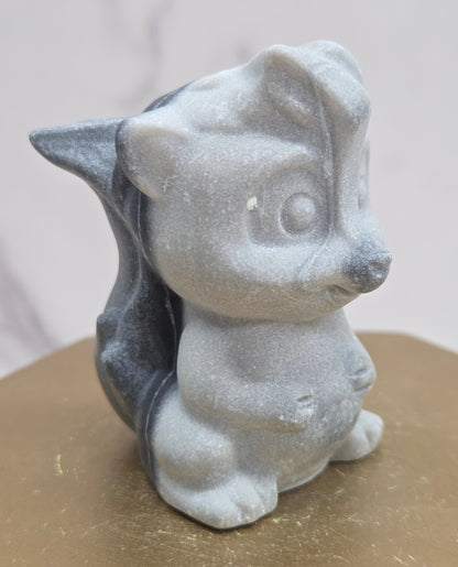 "Flower" skunk carving