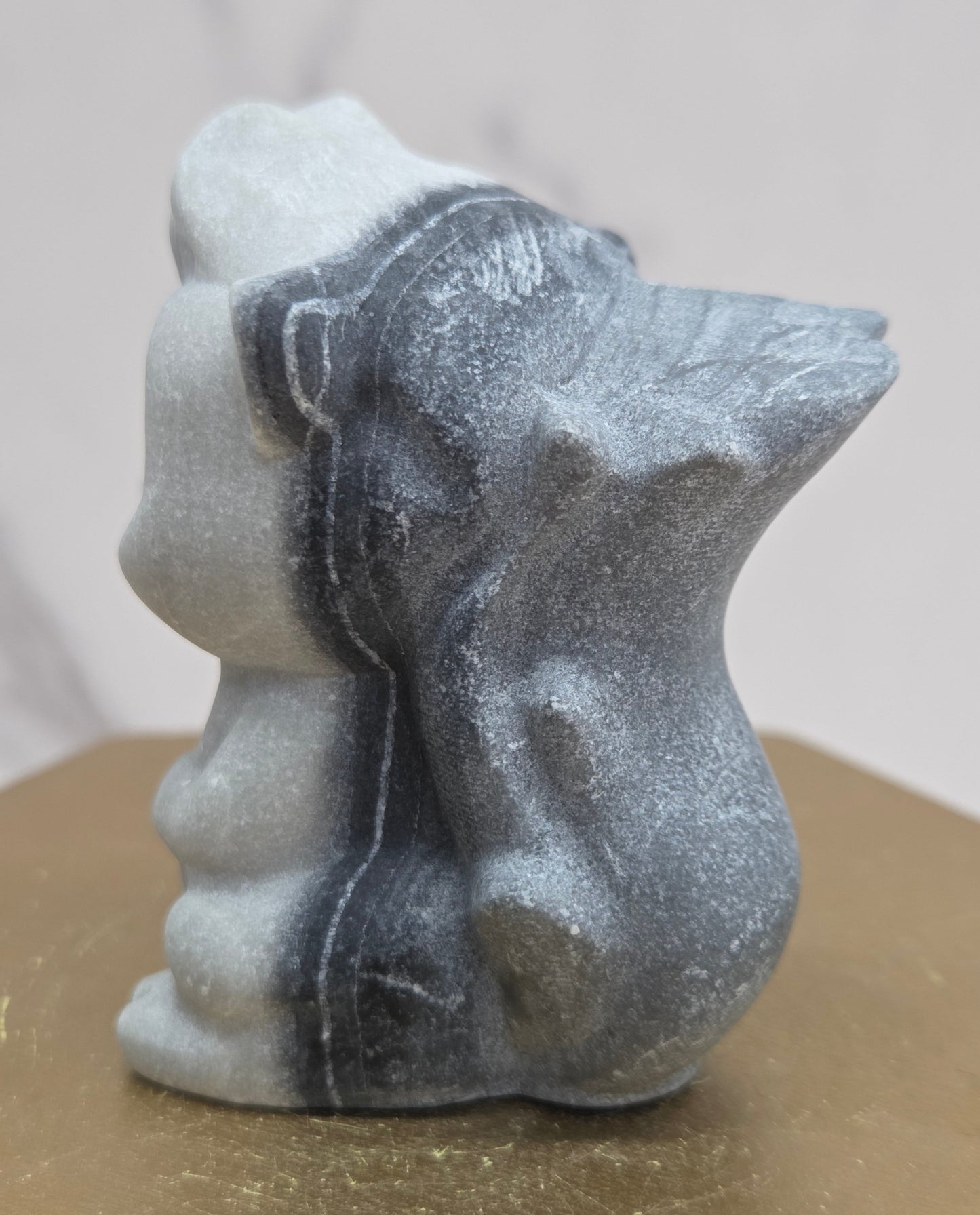 "Flower" skunk carving