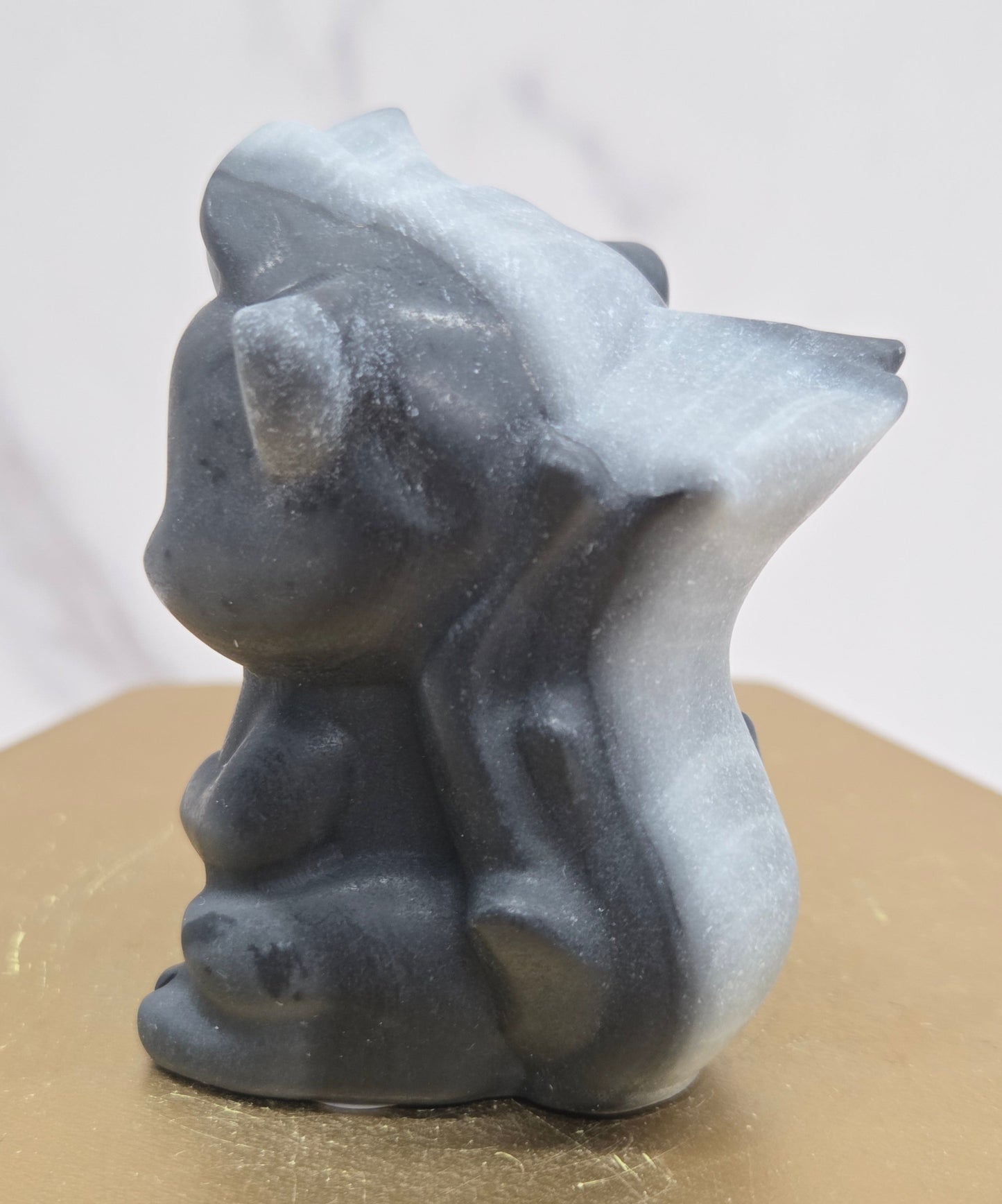 "Flower" skunk carving
