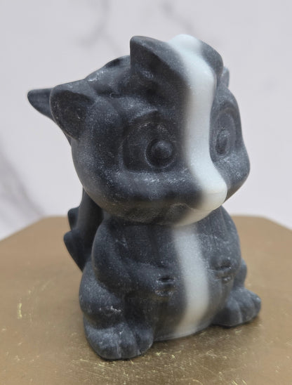 "Flower" skunk carving