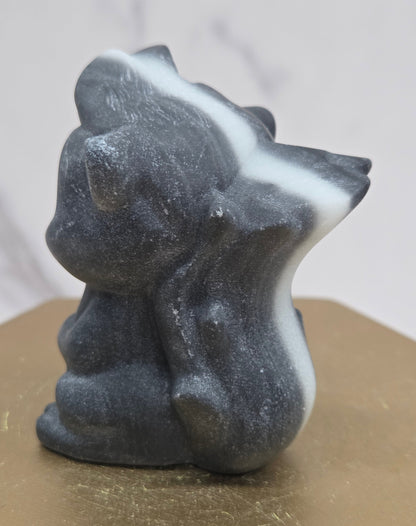 "Flower" skunk carving
