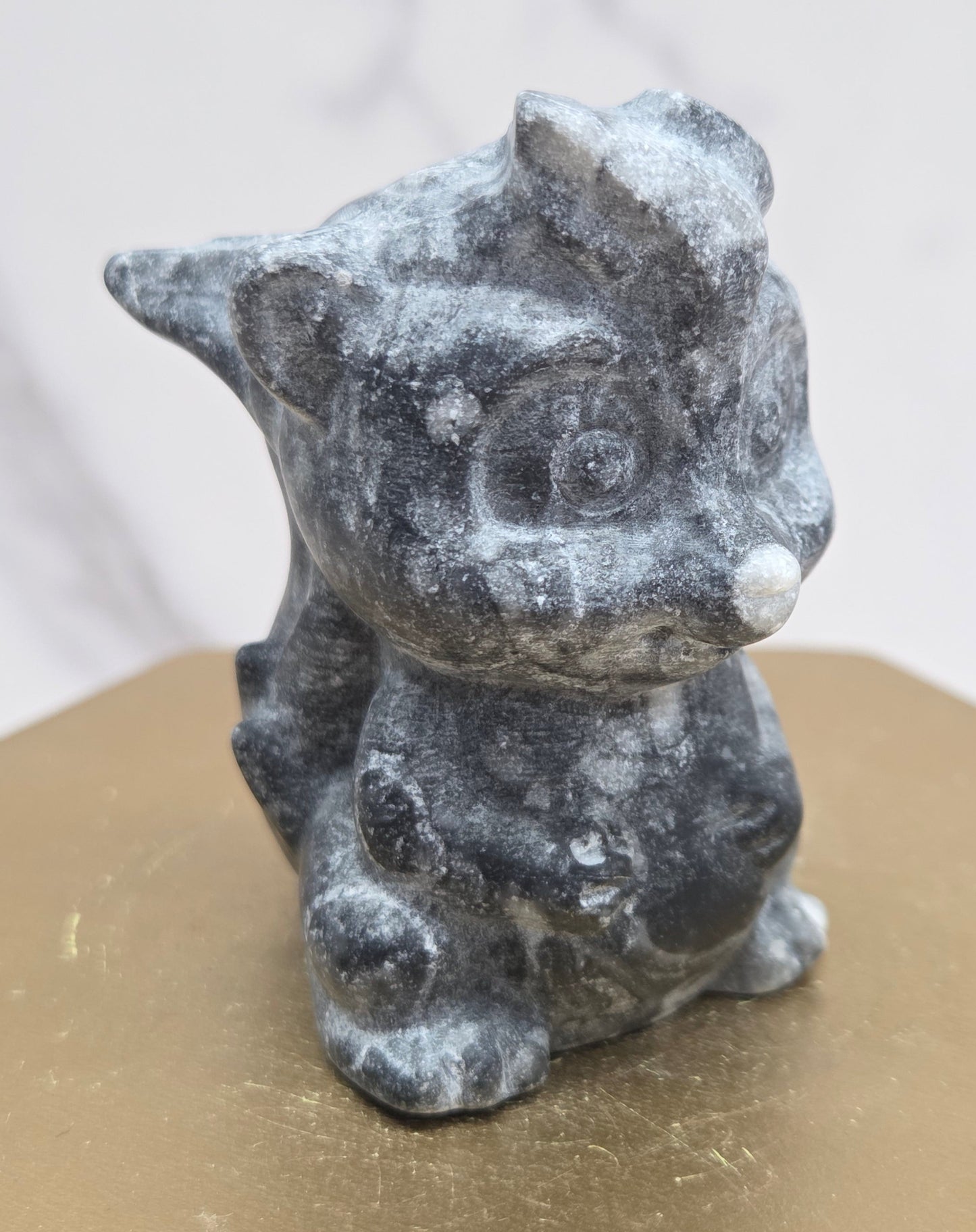 "Flower" skunk carving