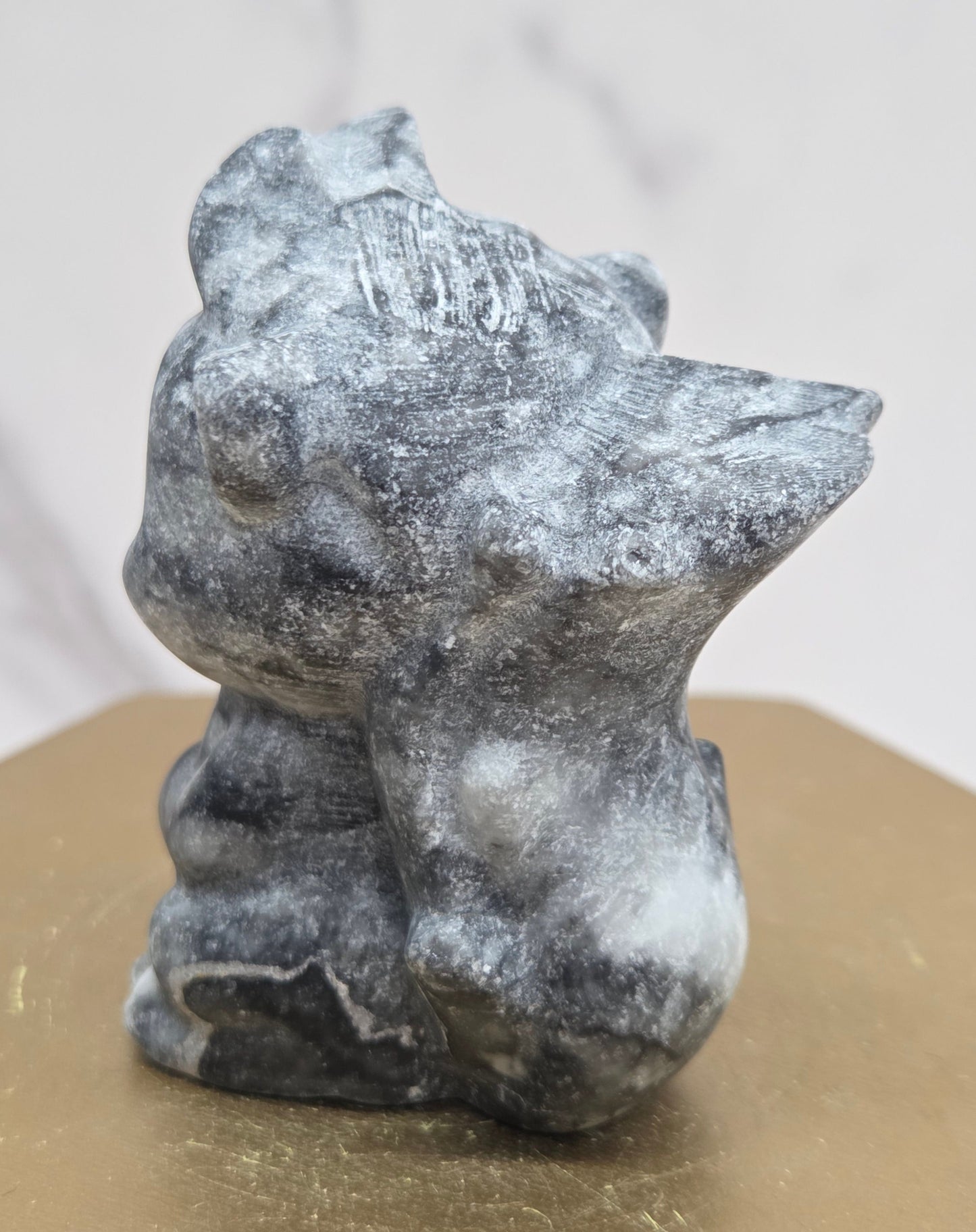 "Flower" skunk carving