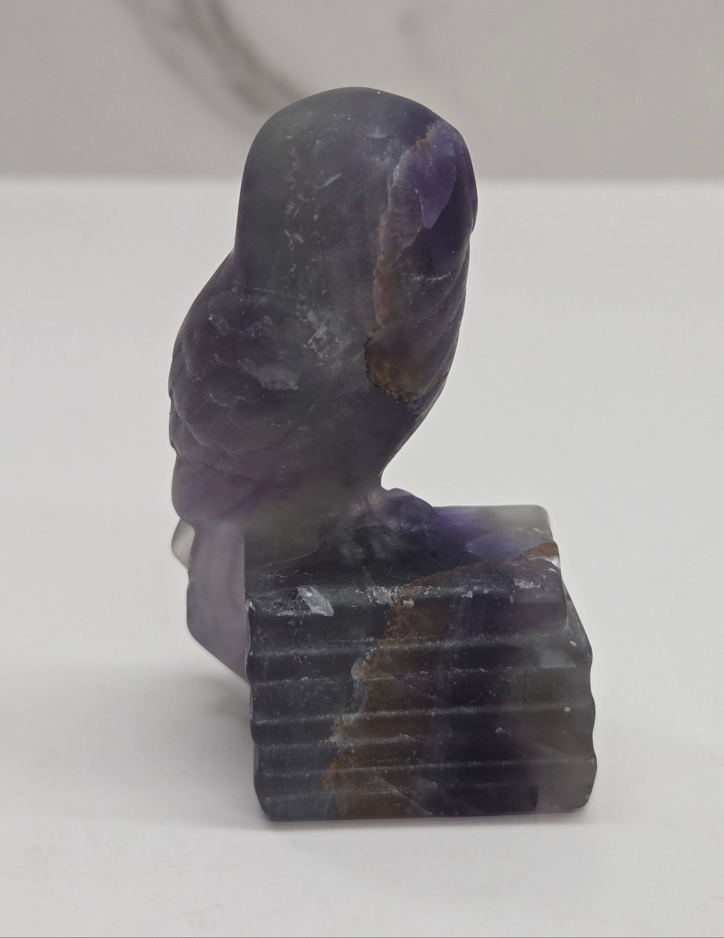 Owl on books carving