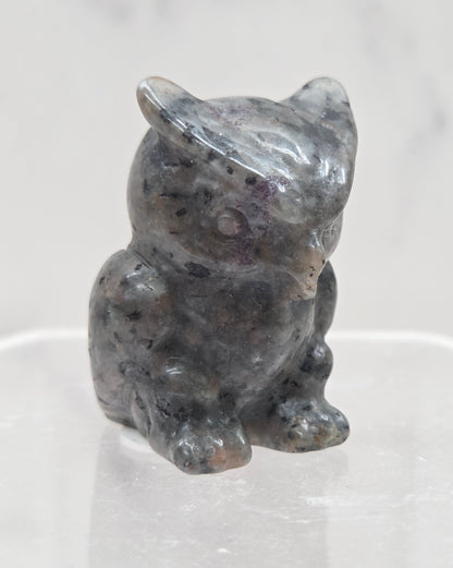 Yooperlite grumpy owl carving on a white background