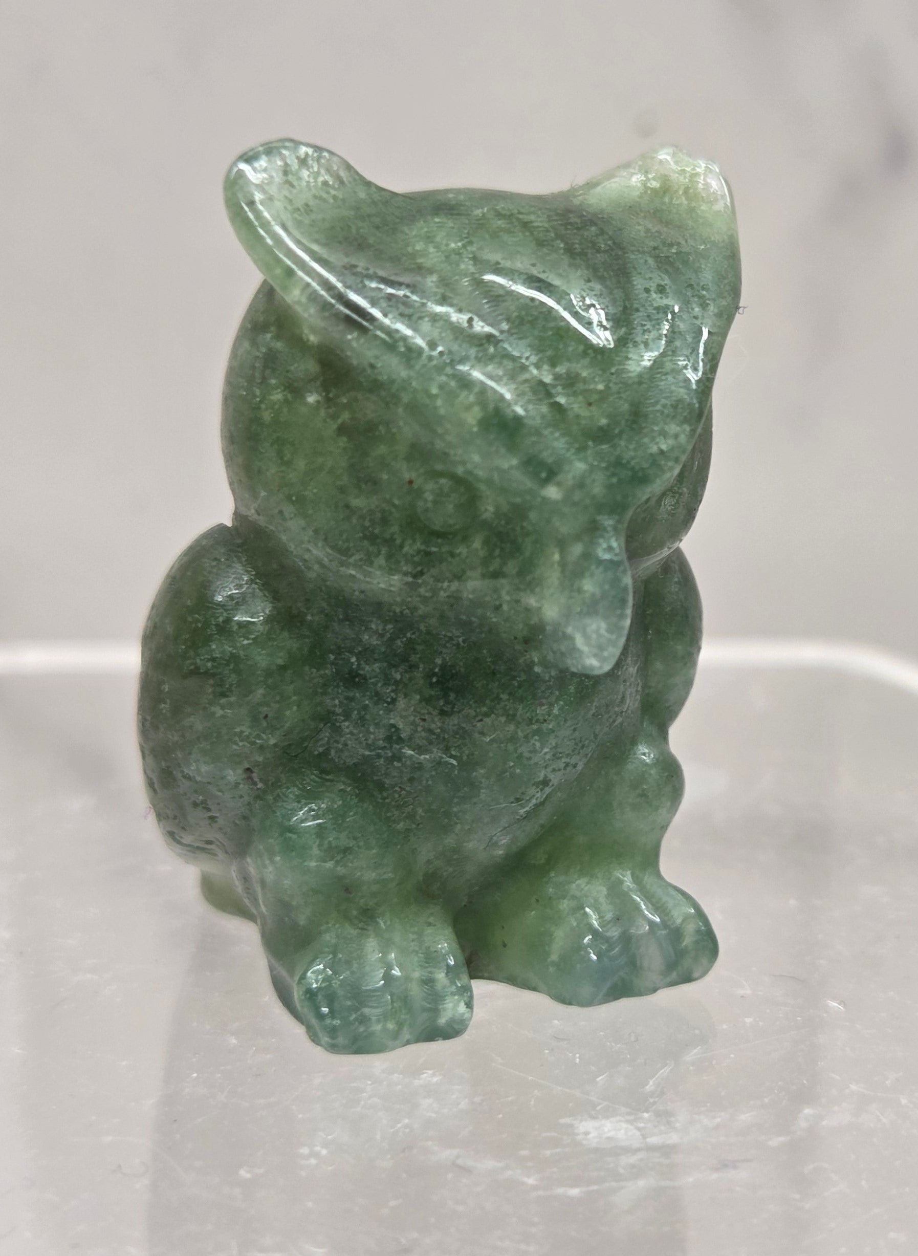 Moss Agate grumpy owl carving on a white background