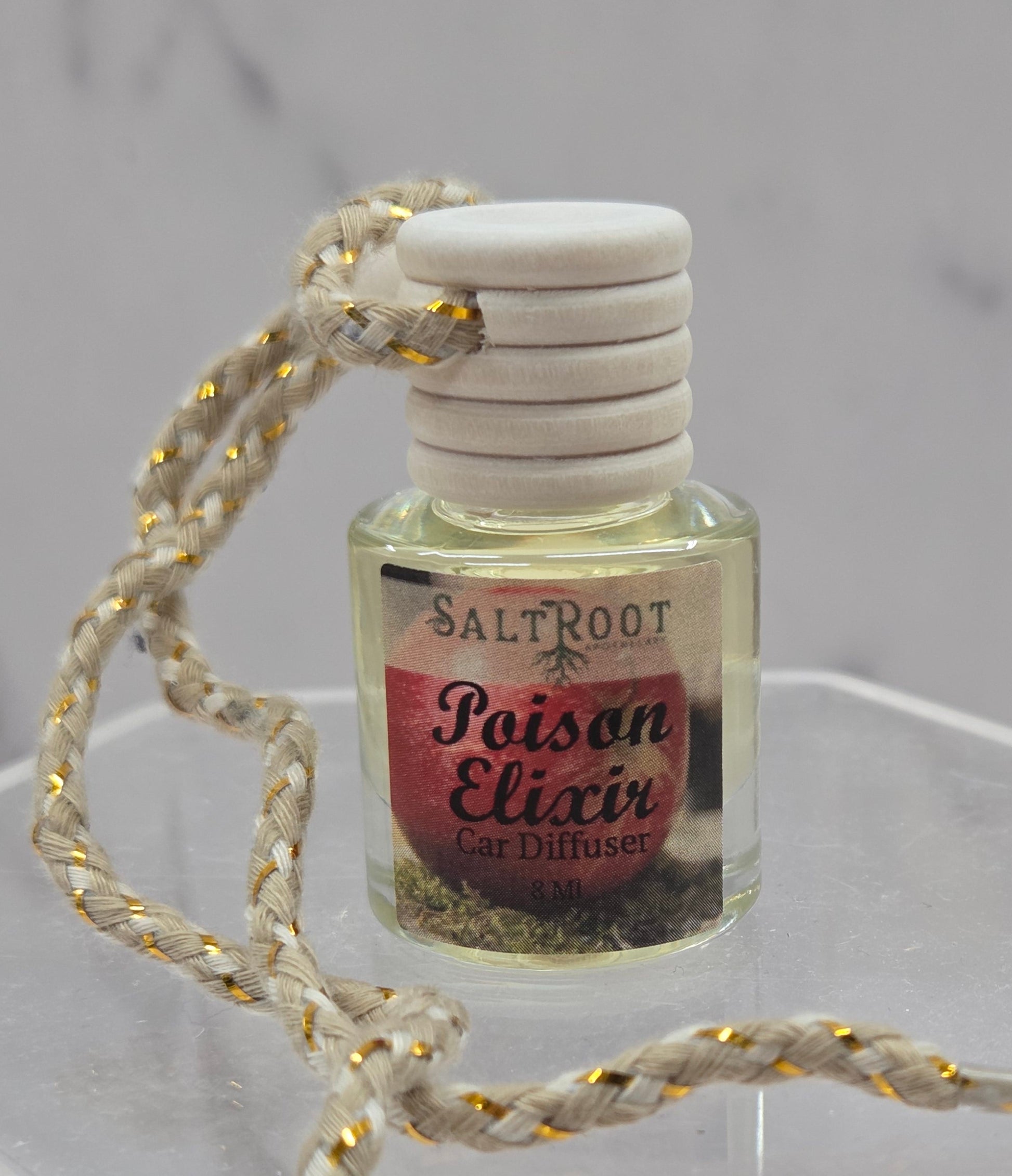 Salt Root Poison Elixir car diffuser on a gray background