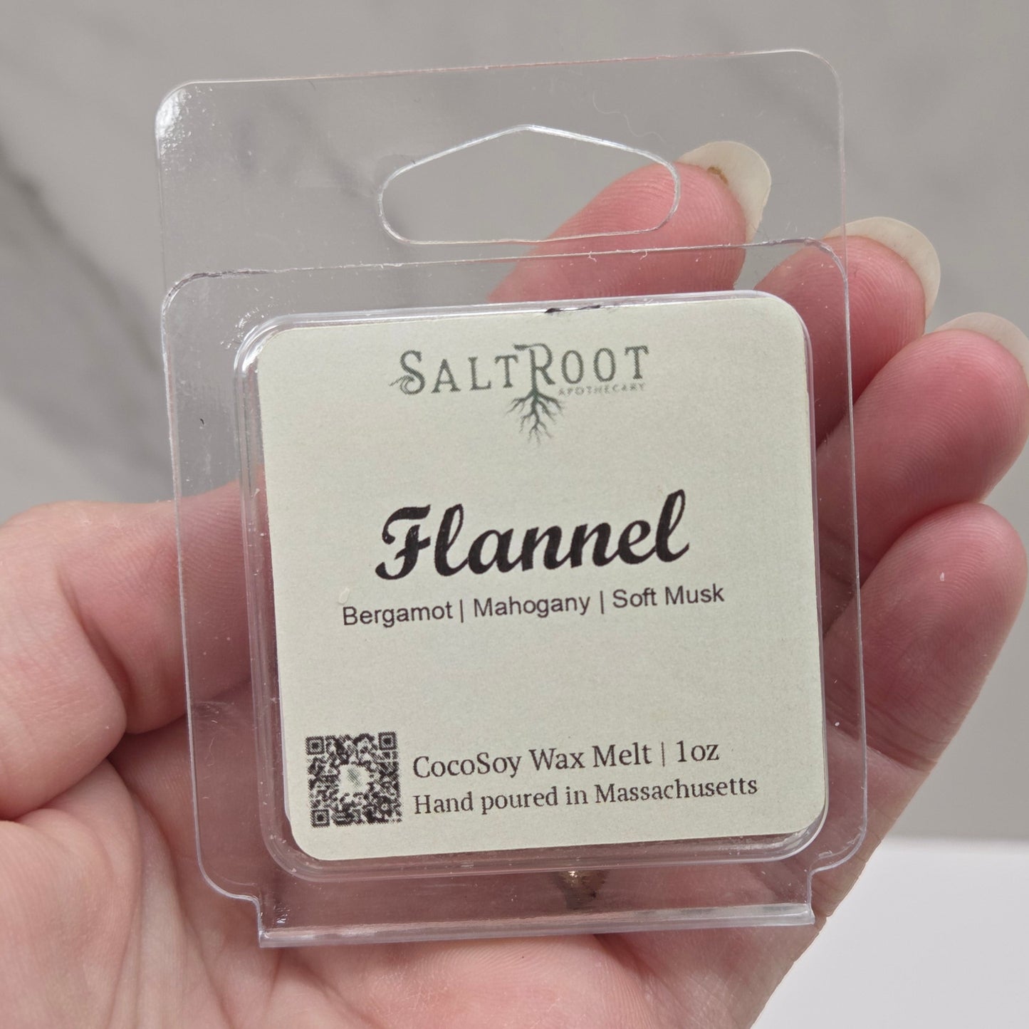 A package of Studio Syx Emporium Soy Wax Melts with the label 'Flannel', indicating a vegan soy wax melt with a net weight of 1 oz.