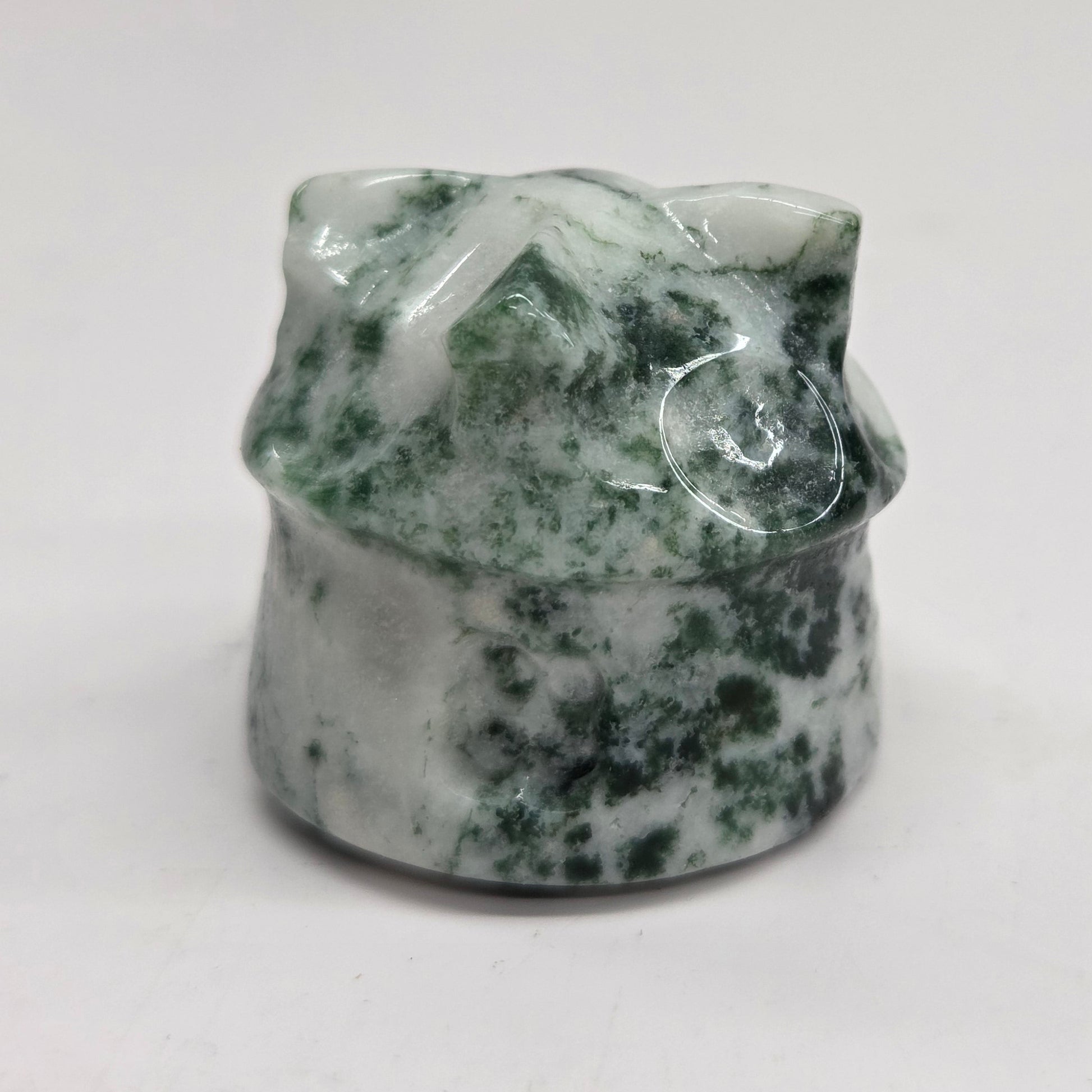 Moss Agate gnome home, each shaped like a small house with character-like features.