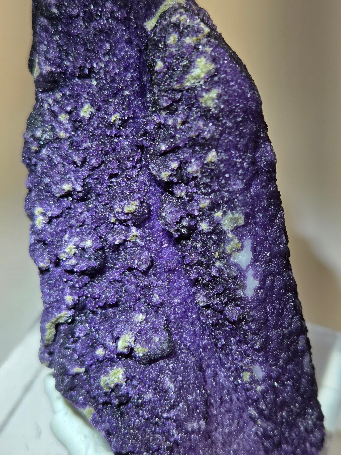 A collection of purple fluorite covered quartz points