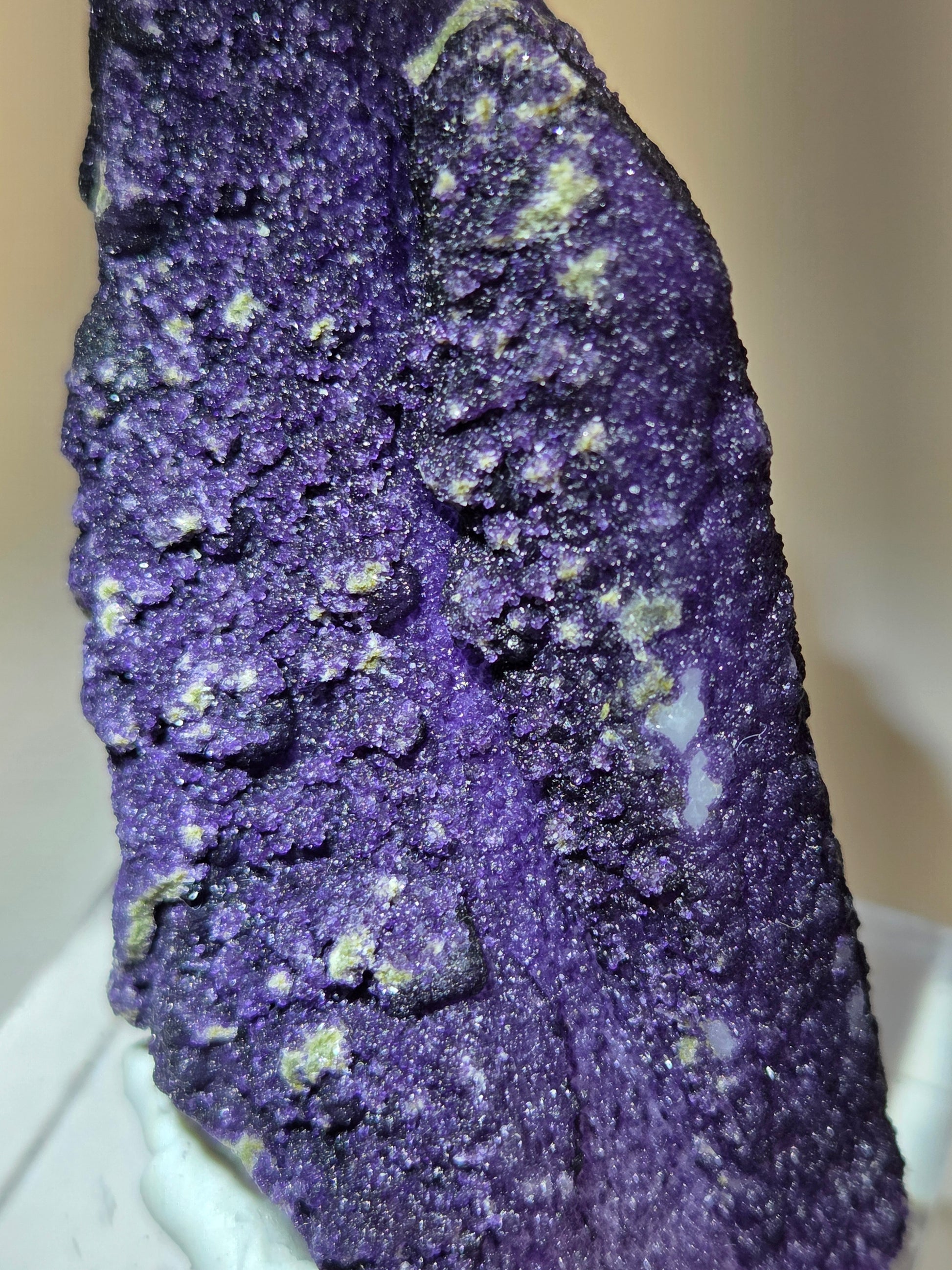 A collection of purple fluorite covered quartz points