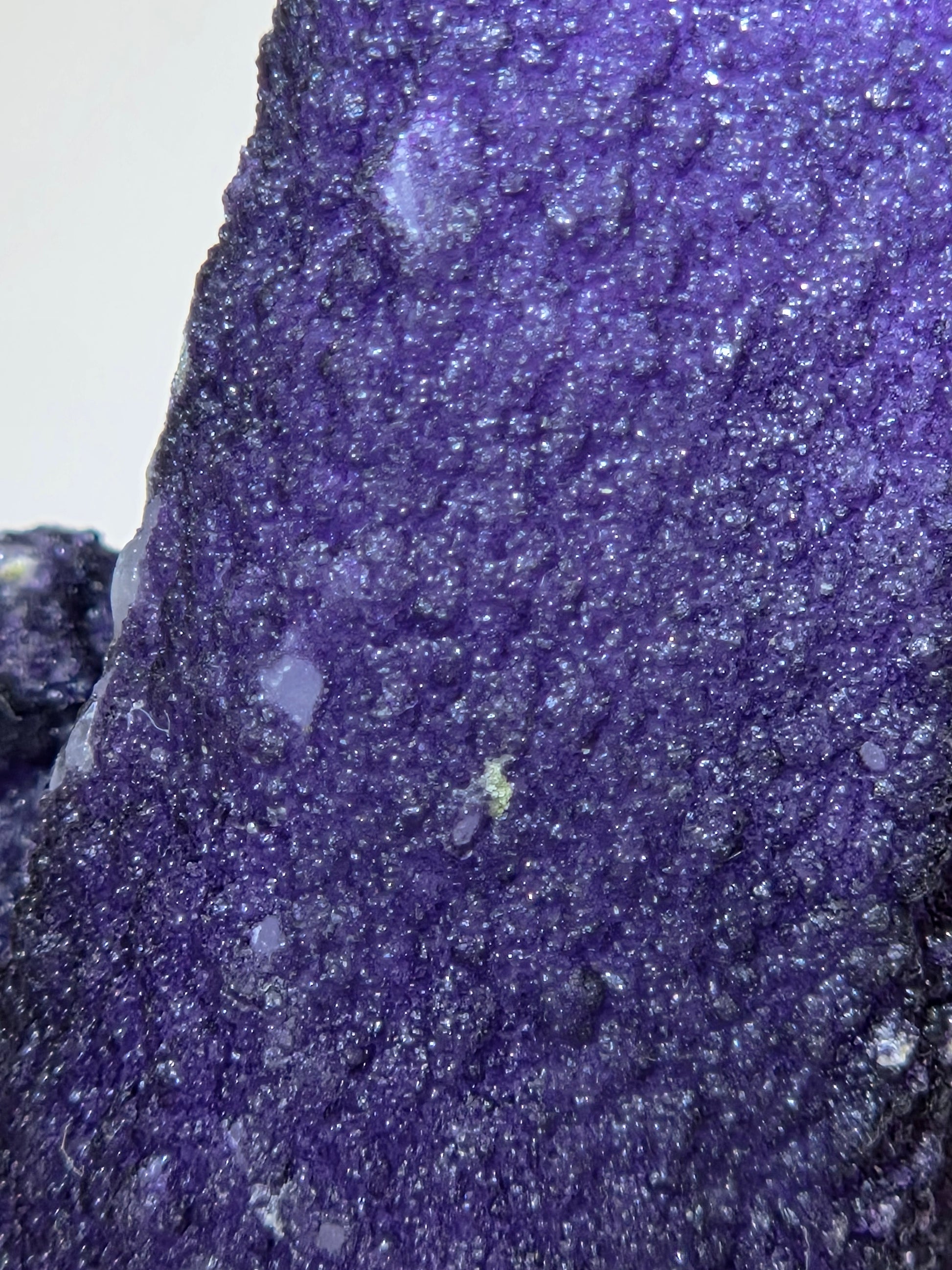 A close-up of purple fluorite covered quartz points